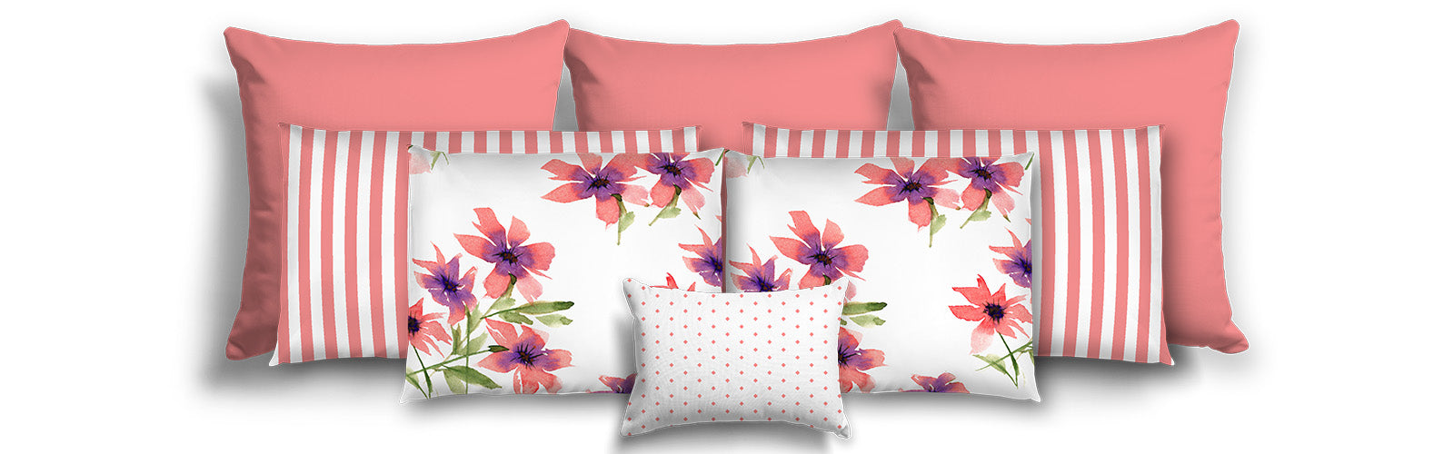 Set of decorative pillows with floral patterns and striped designs on a white background