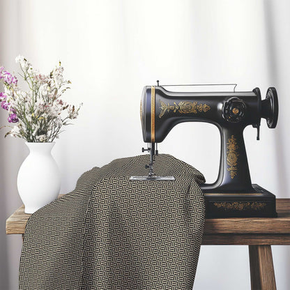 Beige Cotton Sateen Fabric with Black Single Weave Motif Print, FASC-1015-142, on an antique sewing machine sitting on a desk with vase of beautiful flowers.