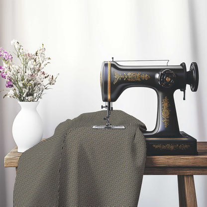 Beige Cotton Sateen Fabric with Black Double Weave Motif Print, FASC-1015-144, on an antique sewing machine sitting on a desk with vase of beautiful flowers.