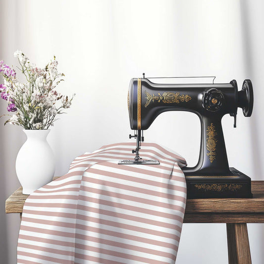 White Cotton Sateen Fabric with Salmon Bars, FACS-1139-051, on an antique sewing machine sitting on a desk with vase of beautiful flowers.