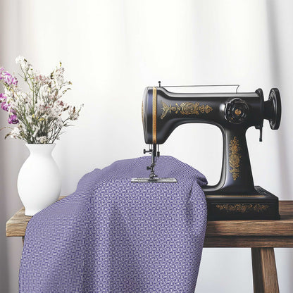 Off-White Cotton Sateen Fabric with Purple Double Weave Motif Print, FASC-1143-144, on an antique sewing machine sitting on a desk with vase of beautiful flowers.