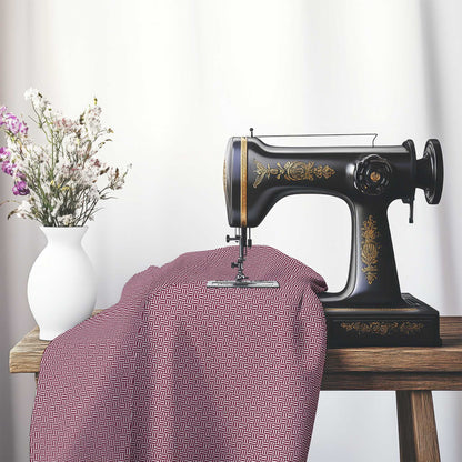 Off-White Cotton Sateen Fabric with Burgundy Red Double Weave Motif Print, FASC-1281-144, on an antique sewing machine sitting on a desk with vase of beautiful flowers.