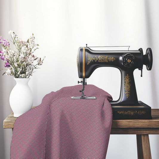 Off-White Cotton Sateen Fabric with Burgundy Red Double Weave Motif Print, FASC-1281-144, on an antique sewing machine sitting on a desk with vase of beautiful flowers.