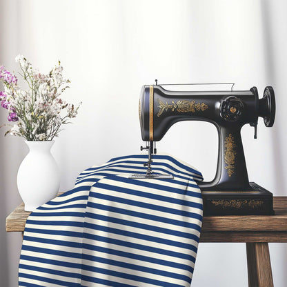 Cotton Sateen Fabric with Royal Blue Bars on Pale Cream, FACS-1293-051, on an antique sewing machine sitting on a desk with vase of beautiful flowers.