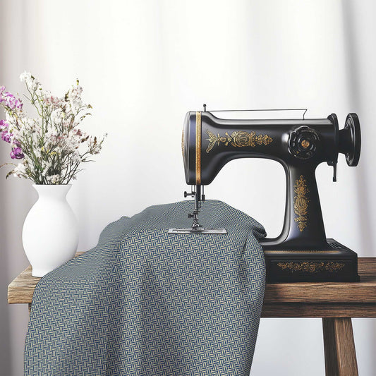Tan Cotton Sateen Fabric with Royal Blue Double Weave Motif Print, FASC-1294-144, on an antique sewing machine sitting on a desk with vase of beautiful flowers.