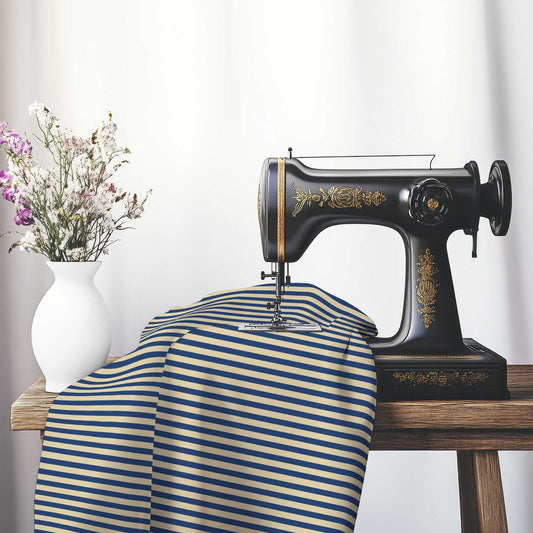 Canvas Fabric with Thin Royal Blue Bars on Tan, FACS-1294-241, on an antique sewing machine sitting on a desk with vase of beautiful flowers.