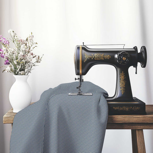 Beige Cotton Sateen Fabric with Royal Blue Double Weave Motif Print, FASC-1295-144, on an antique sewing machine sitting on a desk with vase of beautiful flowers.