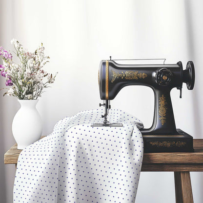 White Cotton Sateen Fabric with Fine Purple Diamonds, FACS-1300-111, on an antique sewing machine sitting on a desk with vase of beautiful flowers.