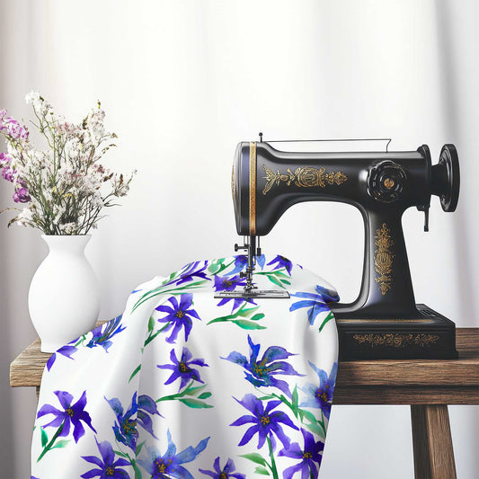 Printed Fabric with Handpainted Purple Watercolor Floral, FACS-1304, on an antique sewing machine sitting on a desk with vase of beautiful flowers.