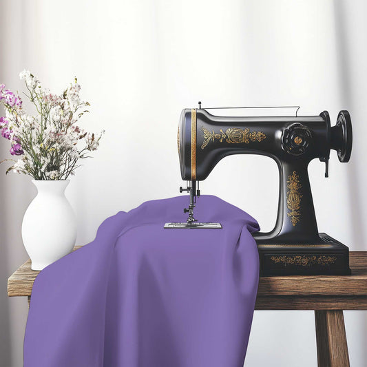 Purple Cotton Sateen Handpainted Purple Watercolor Print, FACS-1320-999, on an antique sewing machine sitting on a desk with vase of beautiful flowers.