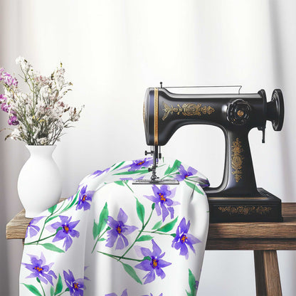 Printed Fabric with Handpainted Purple Watercolor Floral, FACS-1354, on an antique sewing machine sitting on a desk with vase of beautiful flowers.