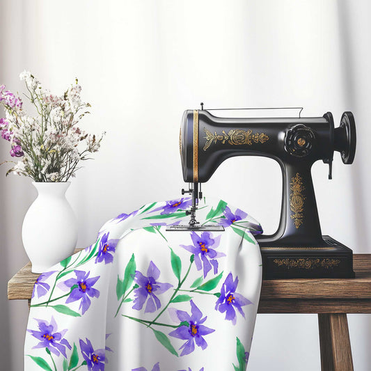 Printed Fabric with Handpainted Purple Watercolor Floral, FACS-1354, on an antique sewing machine sitting on a desk with vase of beautiful flowers.