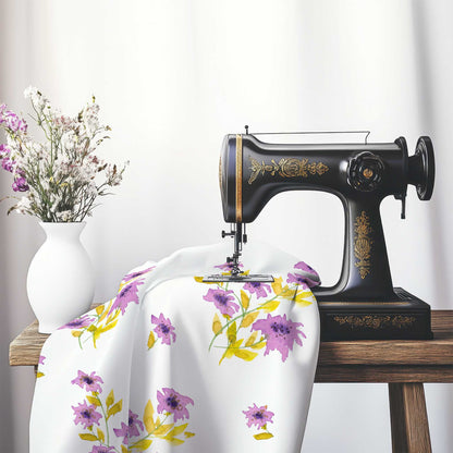 Printed Fabric with Handpainted Mauve Watercolor Floral, FACS-1364, on an antique sewing machine sitting on a desk with vase of beautiful flowers.
