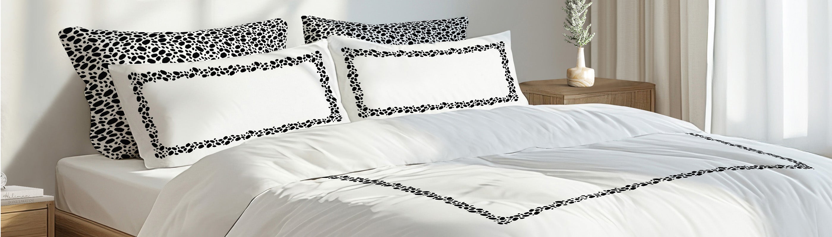 Bed with white bedding and decorative pillows in a bedroom setting