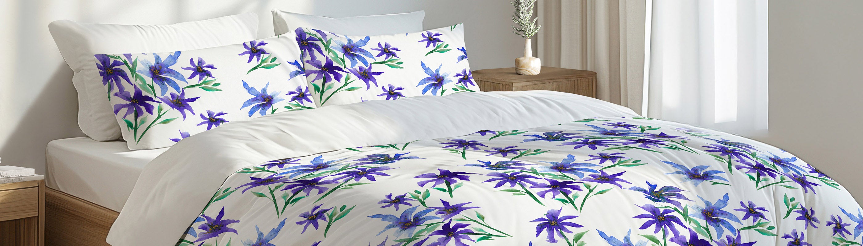 Floral-patterned bedding set on a bed with pillows in a bedroom setting.