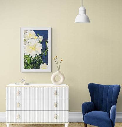 White Peonies Fine Art Print | Styled in Soft Butter-Yellow Bedroom with White Reeded Chest of Drawers, Gold Loop Handles, Donut Ceramic Vase with Orange Craspedia Stems, Cobalt Blue Wingback Chair and White Dome Pendant Light